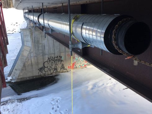 Preinsulated pipe under bridge - Urtech System